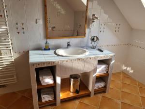a bathroom with a sink and a mirror at Apartmaji PEC-Sitar in Ribnica na Pohorju