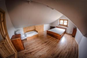 Łóżko lub łóżka w pokoju w obiekcie Siedlisko Matiaszówka