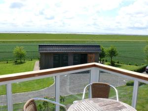 Balkón nebo terasa v ubytování Ferienhaus Wattenmeerblick