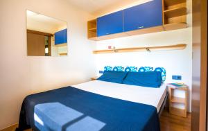 Ein Bett oder Betten in einem Zimmer der Unterkunft Concept Village Piccola Gardiola