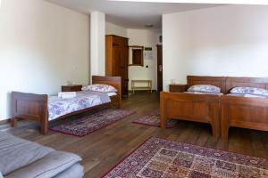 Postel nebo postele na pokoji v ubytování Hotel Lug