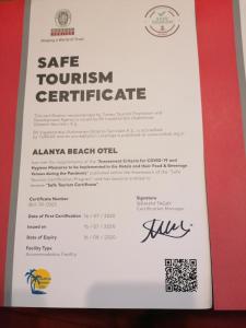 a certificate for a safe tourism certificate with a red border at Alanya Beach Hotel in Alanya