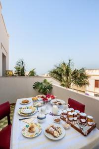 a table with plates of food on top at La Casa al Sole in Mazara del Vallo