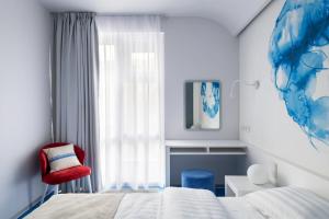 מיטה או מיטות בחדר ב-Starboard Side Hotel