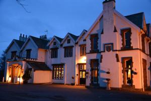 a large white building on the side of a street at The Ennerdale Country House Hotel ‘A Bespoke Hotel’ in Cleator