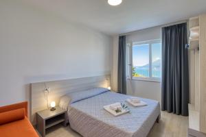 Ένα ή περισσότερα κρεβάτια σε δωμάτιο στο Pinini Country Apartments