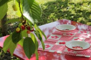 a picnic table with two plates of food on it at La Casa di Muro in Oriolo Romano