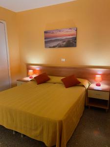 Postel nebo postele na pokoji v ubytování Hotel Ines