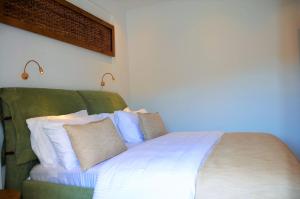 Postel nebo postele na pokoji v ubytování Pagiatakis Suites