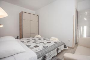 Łóżko lub łóżka w pokoju w obiekcie Apartmani Dragica