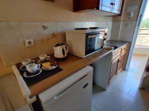 A kitchen or kitchenette at Kalypso studio Resorts