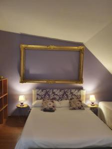 
a bedroom with a large bed and a large mirror at Aramis House Citycentre - con parcheggio Gratis - with Free parking - zona Navigli -Bocconi in Milan
