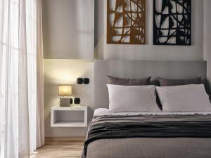 מיטה או מיטות בחדר ב-Pothos Suites