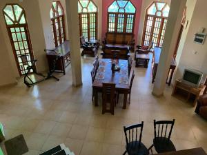 an overhead view of a living room with tables and chairs at The Golden Residence in Kegalle