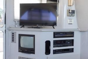 a tv and other electronics in a room at Infinity Yacht in Downtown St Augustine in Saint Augustine