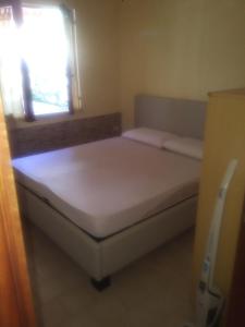 A bed or beds in a room at SCALEA - RIVIERA DEI CEDRI