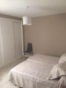 Un pat sau paturi într-o cameră la Apartamento Centro Merced