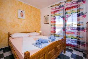 a bedroom with a bed and a window at Villa Cerjan - Sevid in Sevid