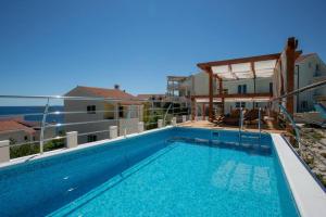 a swimming pool on the roof of a building at Villa Cerjan - Sevid in Sevid