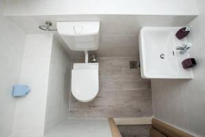 a bathroom with a white toilet and a sink at Villa Cerjan - Sevid in Sevid +19 photos