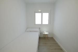 Postel nebo postele na pokoji v ubytování Apartaments Àlex