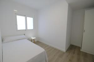 Postel nebo postele na pokoji v ubytování Apartaments Àlex