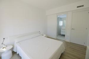 Postel nebo postele na pokoji v ubytování Apartaments Àlex