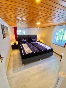 En eller flere senge i et værelse på Ferienhaus Zur Abzuchtinsel