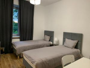 Postel nebo postele na pokoji v ubytování A&B Willa Klaudyny + 37 fotografií