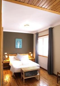 Posteľ alebo postele v izbe v ubytovaní Hostal Fonda Prat