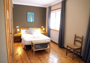 Posteľ alebo postele v izbe v ubytovaní Hostal Fonda Prat