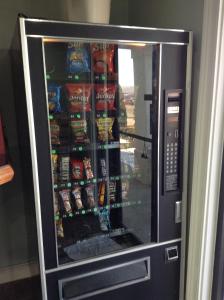 a vending machine with food and drinks in it at Crossroads Inn in Lebanon +7 photos