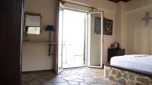 Postel nebo postele na pokoji v ubytování Margina Residence Hotel