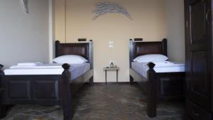 Postel nebo postele na pokoji v ubytování Margina Residence Hotel