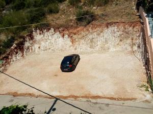 a car driving down a dirt road at Steven in Vasiliki