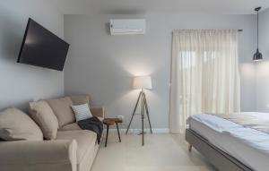 a living room with a couch and a bed at Martinela Villas Istria - Villa Vito in Barban +17 photos