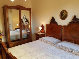 A bed or beds in a room at Vecchia Dimora