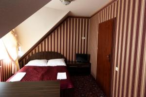 Krevet ili kreveti u jedinici u okviru objekta Hotel Zajazd Celtycki