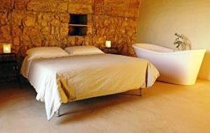 Postel nebo postele na pokoji v ubytování Agriturismo Le Fornelle