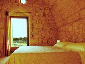 Postel nebo postele na pokoji v ubytování Agriturismo Le Fornelle
