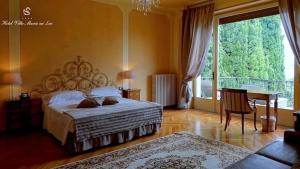 Villa Mimosa au Lac - Estella Hotels Italia tesisinde bir odada yatak veya yataklar