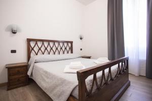 A bed or beds in a room at Hotel Amico