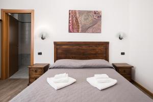 Ένα ή περισσότερα κρεβάτια σε δωμάτιο στο Hotel Amico