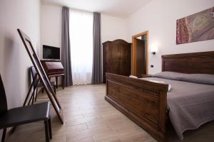 A bed or beds in a room at Hotel Amico