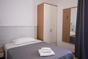 A bed or beds in a room at Hotel Amico