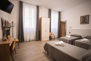 A bed or beds in a room at Hotel Amico