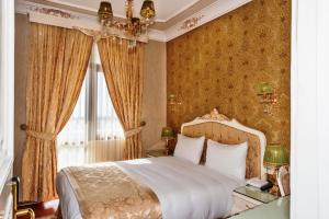 Ein Bett oder Betten in einem Zimmer der Unterkunft Enderun Hotel Istanbul