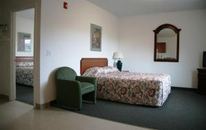 Postel nebo postele na pokoji v ubytování Ponderosa Motel