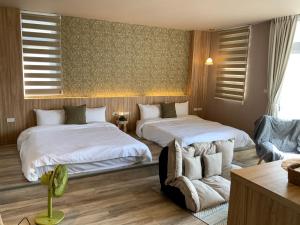 Postel nebo postele na pokoji v ubytování 茉白電梯民宿Bed and Breakfast Elevator 花蓮夜市電梯包棟