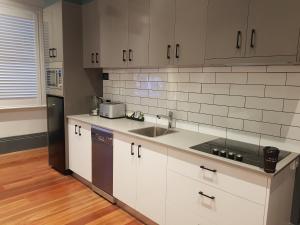 A kitchen or kitchenette at Bespoke On Main